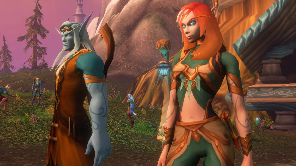 Captura de pantalla de World of Warcraft mostrando a dos personajes elfos en un entorno natural.