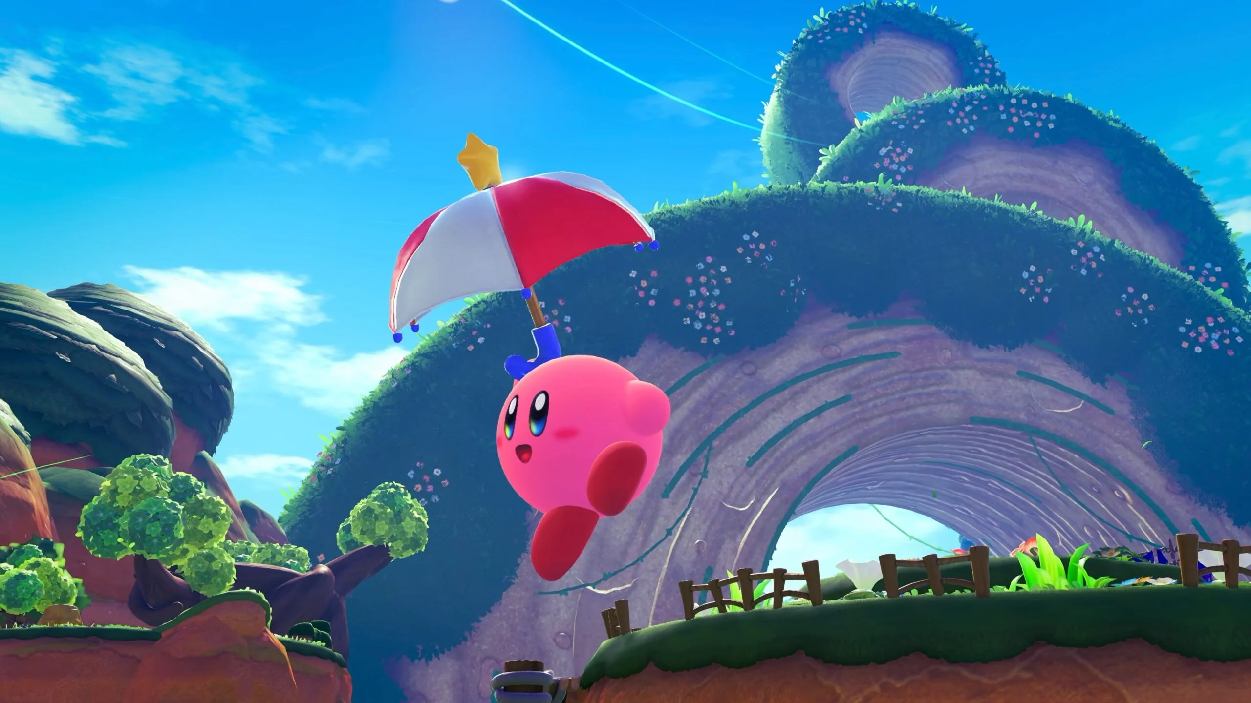 Kirby corriendo en un entorno 3D vibrante en Kirby and the World Beyond