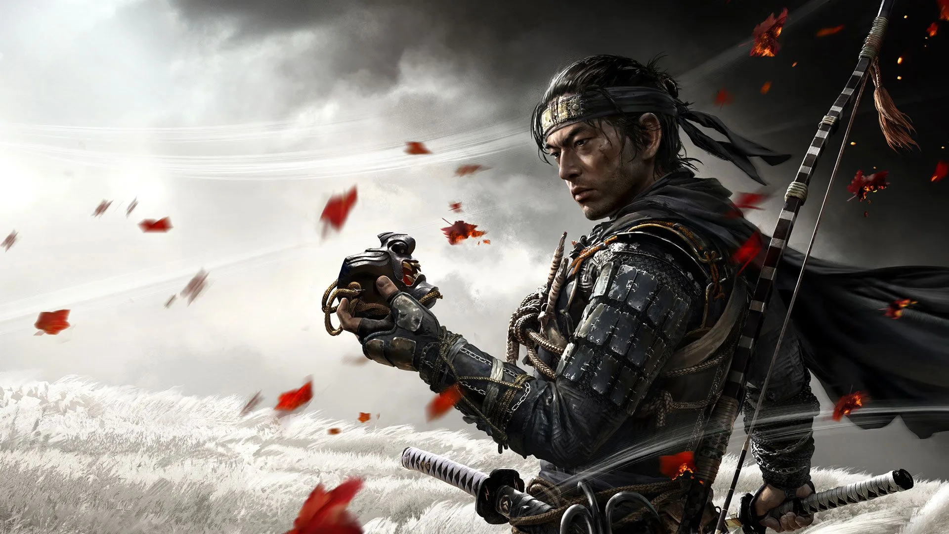 Jin Sakai, protagonista de Ghost of Tsushima, sosteniendo su máscara en un campo de hierba con hojas rojas volando.