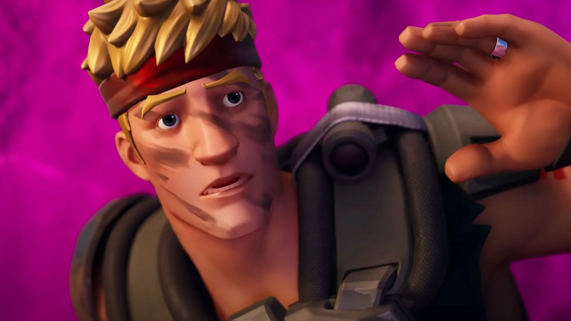 Primer plano del personaje Jonesy de Fortnite con expresión de sorpresa frente a un fondo de color magenta.