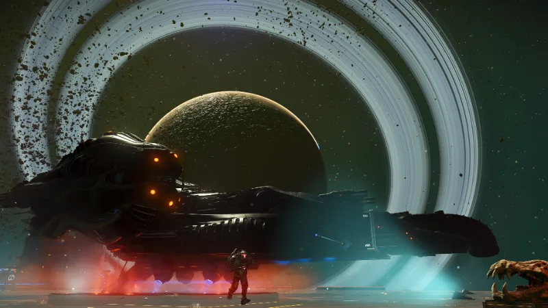 Captura de pantalla de No Man's Sky mostrando una nave espacial oscura frente a un planeta con anillos.